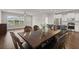 Open dining room with a wood table, seating for six, and a view of the kitchen area at 267 Palmetto Walk Dr, Summerville, SC 29486
