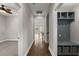 Hallway featuring hardwood floors and a built-in storage nook with cubbies and hooks at 267 Palmetto Walk Dr, Summerville, SC 29486
