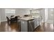 Kitchen island with granite countertops and stainless steel dishwasher adjoins a dining area at 267 Palmetto Walk Dr, Summerville, SC 29486