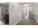 Bright laundry room featuring modern washer and dryer, wire shelving, and convenient storage space at 267 Palmetto Walk Dr, Summerville, SC 29486