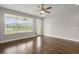 Bright room with wood floors, a ceiling fan, and a large window offering a scenic view at 267 Palmetto Walk Dr, Summerville, SC 29486