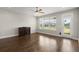 Bright living room with wood floors, a ceiling fan, and a large window with a view at 267 Palmetto Walk Dr, Summerville, SC 29486