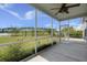 Enjoy the serene outdoor living space with a screened porch and a picturesque view of the tranquil pond at 267 Palmetto Walk Dr, Summerville, SC 29486