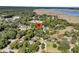 Aerial view of the neighborhood showcasing lush greenery, waterfront access, and the property's location at 3 Birmingham Ct, Charleston, SC 29407