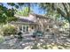 Inviting backyard with a brick home, patio area, and a covered deck, ideal for relaxing or entertaining at 3 Birmingham Ct, Charleston, SC 29407