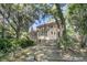 Backyard featuring mature trees and a wooden fence at 3 Birmingham Ct, Charleston, SC 29407
