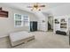 Bright bedroom with built-in shelving, window, ceiling fan and ample space at 3 Birmingham Ct, Charleston, SC 29407