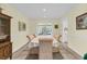 Elegant dining room with a large table, chair rail and ample natural light for gatherings at 3 Birmingham Ct, Charleston, SC 29407