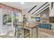 Dining area with vaulted ceiling, access to the back patio, and open to the living area at 3 Birmingham Ct, Charleston, SC 29407