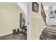 Inviting entryway featuring a coat rack, storage, and stairs leading to the upper level at 3 Birmingham Ct, Charleston, SC 29407