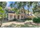 Exterior view of home with covered porch and lush landscaping at 3 Birmingham Ct, Charleston, SC 29407