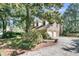 Exterior view of home with a two car garage and mature trees at 3 Birmingham Ct, Charleston, SC 29407