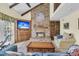Living room with vaulted ceiling, brick fireplace, and an open floor plan at 3 Birmingham Ct, Charleston, SC 29407