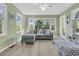 Sunroom with large windows, ceiling fan, and comfortable seating, perfect for relaxation at 3 Birmingham Ct, Charleston, SC 29407
