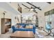 Open concept living area with vaulted ceilings, large windows, and access to the kitchen and upstairs at 3 Birmingham Ct, Charleston, SC 29407
