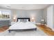 Serene bedroom with neutral tones, a comfortable bed, and a view from a bright window at 3009 Palm Blvd, Isle of Palms, SC 29451