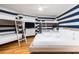 Bedroom featuring one queen bed and one bunkbed with blue and white striped walls at 3009 Palm Blvd, Isle of Palms, SC 29451