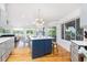 Open kitchen with a large center island, stylish lighting, and a seamless flow to living spaces at 3009 Palm Blvd, Isle of Palms, SC 29451