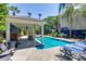 Backyard oasis with pool, outdoor kitchen, and lounge area perfect for entertaining and relaxation at 3009 Palm Blvd, Isle of Palms, SC 29451