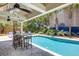 Relaxing outdoor pool featuring an adjacent bar and lounge area, perfect for enjoying the sunshine and entertaining guests at 3009 Palm Blvd, Isle of Palms, SC 29451