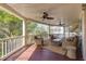 Spacious porch with comfortable seating, ceiling fans, and a serene outdoor space for relaxing and enjoying the view at 3009 Palm Blvd, Isle of Palms, SC 29451