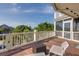Spacious porch with ample seating offers a relaxing spot to enjoy the surrounding views and outdoor living at 3009 Palm Blvd, Isle of Palms, SC 29451