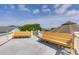 Expansive rooftop deck with seating provides stunning views and an exceptional outdoor living space for entertaining at 3009 Palm Blvd, Isle of Palms, SC 29451