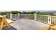 Spacious rooftop deck with pineapple railings and wooden benches offers panoramic views and outdoor relaxation at 3009 Palm Blvd, Isle of Palms, SC 29451