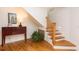 Staircase with hardwood floors and a traditional-style side table with lamp at 3009 Palm Blvd, Isle of Palms, SC 29451