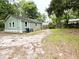 Expansive backyard with gravel and a large green space, great for outdoor activities at 307 Mill St, Walterboro, SC 29488