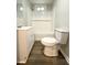 Clean bathroom features a vanity sink, toilet, and tiled shower/tub combo at 307 Mill St, Walterboro, SC 29488