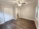 Cozy bedroom features a ceiling fan, closet space, and a window for natural light at 307 Mill St, Walterboro, SC 29488