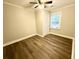 Simple bedroom offers ceiling fan, flooring, and natural light from a window at 307 Mill St, Walterboro, SC 29488