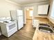 Functional kitchen featuring white appliances, butcher block countertops, and ample storage at 307 Mill St, Walterboro, SC 29488