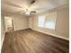 Bright living room features stylish flooring and abundant natural light through large windows at 307 Mill St, Walterboro, SC 29488