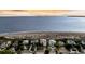 Coastal real estate: beach houses line the oceanfront with stunning views and access to the sandy shore and scenic ocean landscape at 3128 Palmetto Blvd, Edisto Island, SC 29438