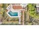 Aerial view of the backyard pool, deck and walkway leading to the beach at 3128 Palmetto Blvd, Edisto Island, SC 29438