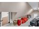 Spacious carpeted attic storage space with dormer window and easy access at 3128 Palmetto Blvd, Edisto Island, SC 29438
