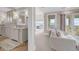 Bright and airy bathroom with dual sinks, a spacious vanity, and a picturesque ocean view, creating a spa-like experience at 3128 Palmetto Blvd, Edisto Island, SC 29438