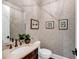 Chic powder room with decorative wallpaper and elegant fixtures at 3128 Palmetto Blvd, Edisto Island, SC 29438