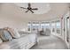 Sun-filled main bedroom with ocean views, a seating area, and a soft color palette, creating a serene retreat at 3128 Palmetto Blvd, Edisto Island, SC 29438