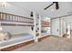 Unique bunkroom featuring built-in beds and ample storage at 3128 Palmetto Blvd, Edisto Island, SC 29438