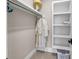 Organized walk-in closet with shelves and hanging rod; ideal for storage at 3128 Palmetto Blvd, Edisto Island, SC 29438