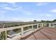 Expansive wooden deck offering stunning ocean views and outdoor seating, perfect for relaxation at 3128 Palmetto Blvd, Edisto Island, SC 29438