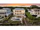 Stunning multi-story home with a pool, outdoor lounge, and lush landscaping, perfect for coastal living at 3128 Palmetto Blvd, Edisto Island, SC 29438