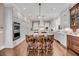 Spacious kitchen featuring a large island, pendant lighting, and stainless steel appliances at 3128 Palmetto Blvd, Edisto Island, SC 29438