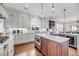Bright kitchen with a central island, custom cabinets, and modern appliances, perfect for cooking at 3128 Palmetto Blvd, Edisto Island, SC 29438