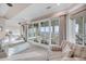 Bright living room featuring beach views through sliding glass doors and comfortable seating at 3128 Palmetto Blvd, Edisto Island, SC 29438