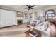 Elegant living room with fireplace, plush seating, and staircase at 3128 Palmetto Blvd, Edisto Island, SC 29438