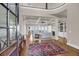 Elegant living room with coffered ceilings, fireplace, and access to the beautiful ocean view at 3128 Palmetto Blvd, Edisto Island, SC 29438